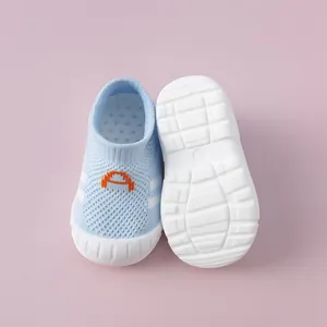 Detailed view of breathable blue knitted baby walking shoes with anti-slip soft sole