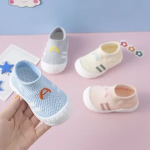 Detailed view of breathable flyknit baby walking shoes in various soft pastel colors
