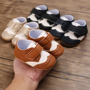 Collection of various colors of non-slip baby walking shoes with hook and loop straps.
