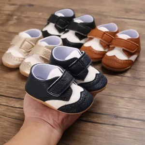 Close-up of navy blue baby walking shoes with multiple color options in background