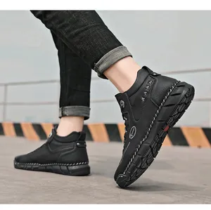 Close-up of black high-top work boots with non-slip rubber soles