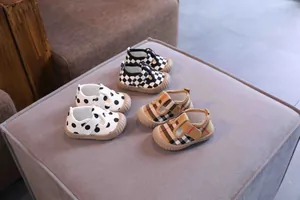 Group of toddler soft-sole canvas shoes in polka dot, checkerboard and plaid prints