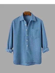 Detailed view of a premium blue corduroy long-sleeve shirt with a classic lapel design