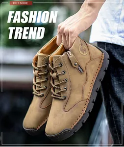 Detailed view of men's mid-top brown leather outdoor casual boots with side zipper