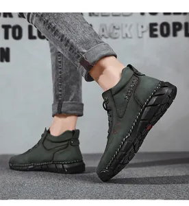 Side view of men's dark green high-top casual work boots with hand-stitched detailing.