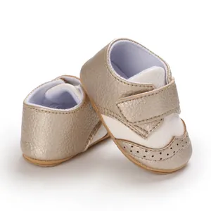 Close-up view of gold champagne baby walking shoes with hook and loop strap and soft non-slip sole
