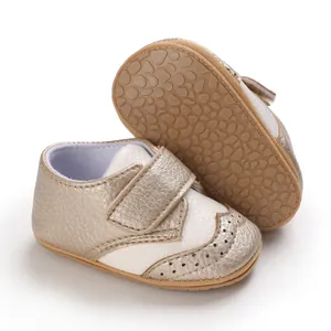 Detailed close-up view showing the non-slip rubber sole of gold baby walking shoes