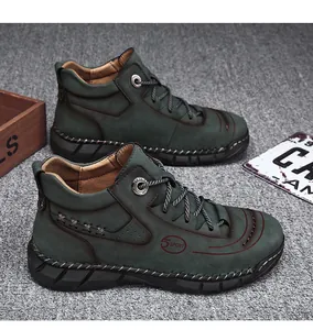 Dark green high-top men's work shoes with durable rubber sole and lace-up design
