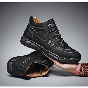 Side view of black high-top leather work boots featuring 5 SPORT logo and stitch detail