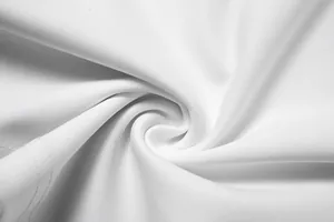 Vue macro détaillée de la texture du tissu blanc respirant pour combinaison femme