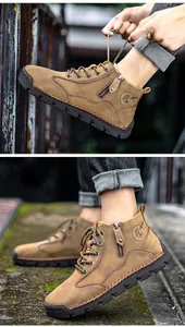 Detail view of retro men's leather work boots with side zipper and rugged sole