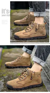 Classic men's brown leather work boots with side zipper, tree logo and durable sole