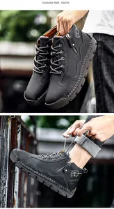 Detailed macro view of mens black leather outdoor work boots with side zipper and laces