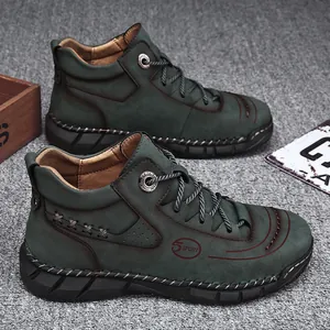 High-quality men's high-top dark green leather work boots with a rugged lug sole