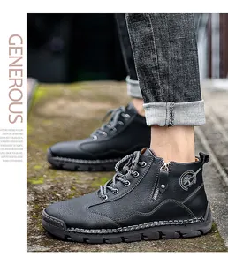 Close-up of men's black leather work boots featuring side zipper and tree logo