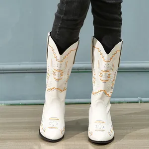 Stylish white mid-calf Western cowboy boots featuring colorful ethnic embroidery
