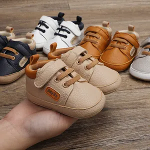 Macro view of soft faux leather baby walking shoes with Baby Boy logo in various colors