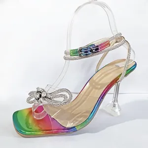 Rainbow metallic high heel sandals with sparkling rhinestone bow and clear straps