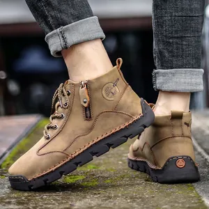 Stylish men's leather outdoor retro work boots in a casual mid-top brown design.