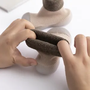 Detail of warm baby walker shoes with thick lamb wool lining and elastic sock design.