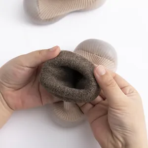 Close-up of the thick brown fleece lining in these warm winter baby sock shoes
