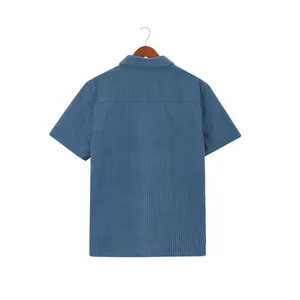 Detailed back view of a blue waffle knit short-sleeved shirt hanging on a hanger