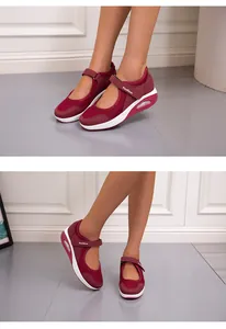 Close-up of wine-red breathable mesh Mary Jane sneakers with velcro strap and air cushion sole.