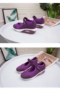 Detailed view of breathable purple mesh walking shoes with hook and loop straps.