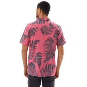 Detailed back view of pink men's summer beach shirt with green fern leaf print