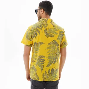 Back view of a yellow short-sleeved men's casual shirt featuring a grey fern leaf print.