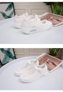Detailed view of white breathable mesh walking shoes with Velcro strap and air cushion.