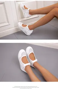 Detailed view of white mesh Mary Jane walking shoes with velcro strap and air cushion