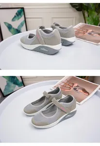 Close-up of grey breathable mesh women's shoes with velcro strap and air cushion sole
