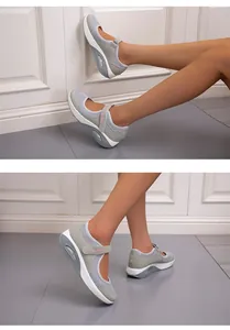 Close-up detail of grey breathable mesh summer shoes featuring pink Fashion velcro strap