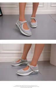 Side view of breathable grey mesh walking shoes with air cushion sole and adjustable velcro strap