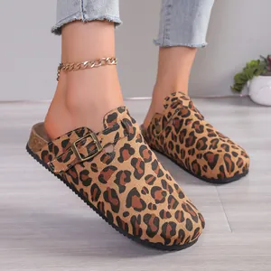 Detailed view of leopard print clogs with adjustable side buckle straps