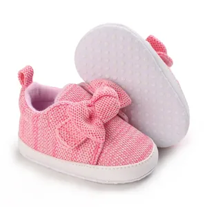 Pink knitted baby walking shoes with cute bowknot detail for infants aged 0-1 year