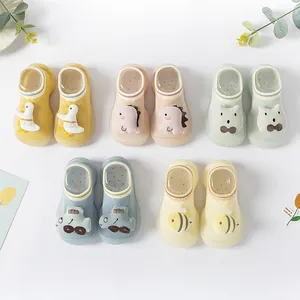 Detail view of baby floor socks shoes with non-slip silicone soles and cartoon patterns