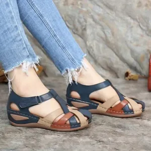 Close-up of casual women's color-block wedge sandals featuring velcro straps and contrast stitching