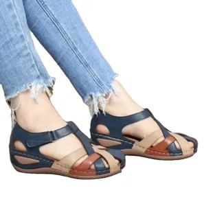 Casual women's wedge sandals with multi-color interlaced straps and velcro strap closure.