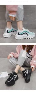 Detailed showcase of women's colorblock flyknit chunky sneakers in white and black colors
