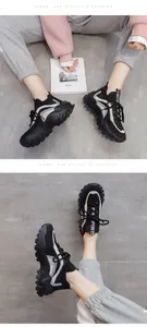 Close-up of stylish women's black flyknit chunky sneakers with white color-blocked design