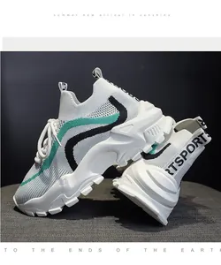 Close-up of color-block chunky sneakers with breathable knit and 'SPORTS' detail