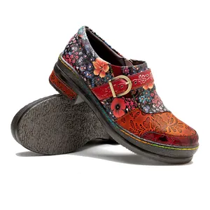 Vintage ethnic floral women's flat shoes with red buckle strap and thick textured sole.