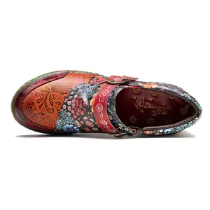 Top view of vintage floral leather flat shoes with ethnic patchwork design