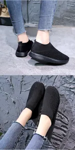 Détail des baskets en maille noire respirante pour femmes avec semelle ondulée