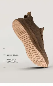 Close-up macro view of the anti-slip textured sole on brown breathable mesh sneakers