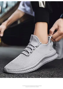 Close-up of grey breathable flyknit sneaker showing mesh texture and lightweight EVA sole.