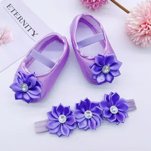 Purple infant princess shoes and floral headband set with rhinestone detail.