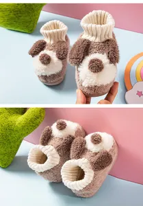 Detailed macro view showing the soft plush puppy dog design of indoor toddler slippers